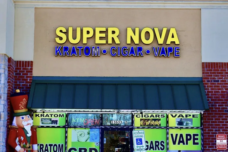 The Supernova Tobacco & Vape storefront in Newport News, with its illuminated sign and product windows for kratom, cigars and vape.
